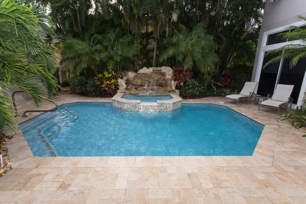 Small Backyard Swimming Pool with Spa & Rock Waterfall