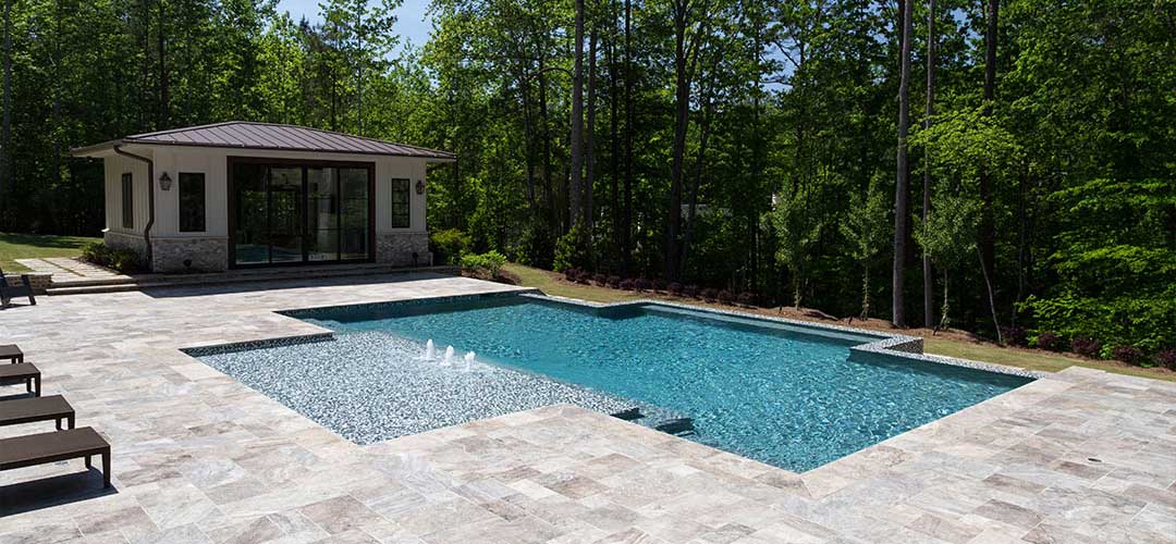 Outdoor pool by forest